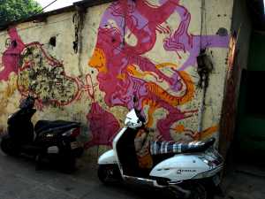 Blowing bubbles over bikes in Bandra